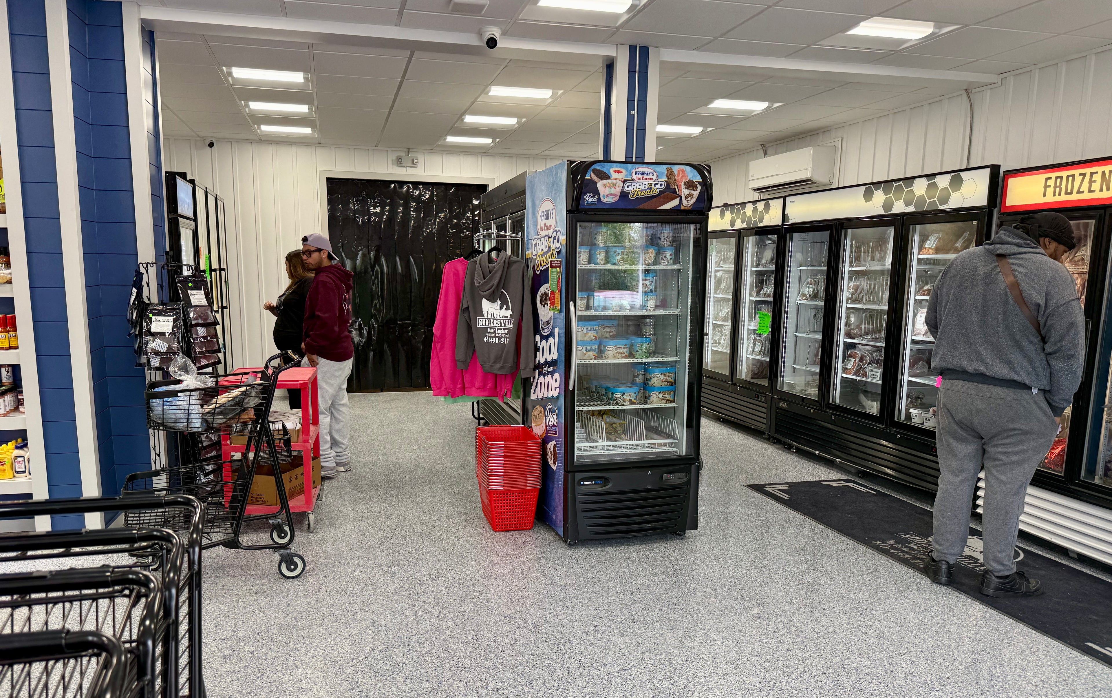 Smoked meats store with customers shopping