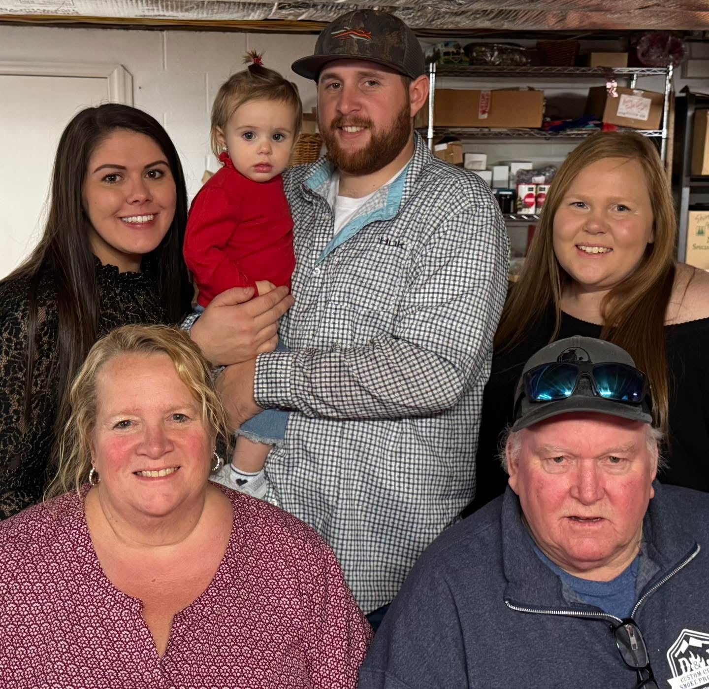 Three women, two men, and a child, who make up the family who runs the business.